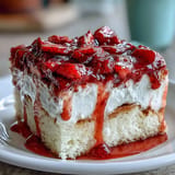 Decadent Strawberry Horchata Tres Leches Cake, moist and swirled with cream.