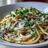 Flaky sardines tossed in rich, zesty lemon cream sauce, a quick weeknight meal.