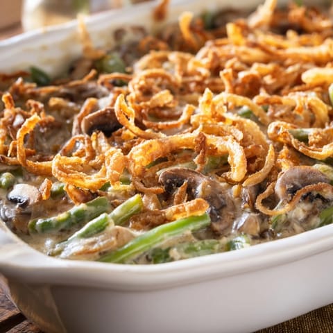 Tender green beans coated in creamy mushroom sauce and topped with crispy fried onions.