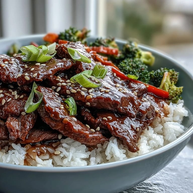 Savory Teriyaki Beef Bowl served hot with juicy beef strips, colorful bell peppers, and steamed rice.