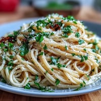 Easy Lemon Butter Pasta with bright lemon zest and creamy Parmesan sauce in a skillet