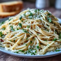Creamy garlic butter pasta with Parmesan, a comforting Italian dish.
