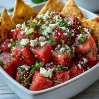 Refreshing Watermelon Feta Salsa with crispy pita chips, a vibrant summer appetizer.